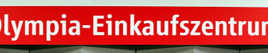 Stationsschild U-Bahnhof Olympia-Einkaufszentrum (U1) aus dem Jahr 2006